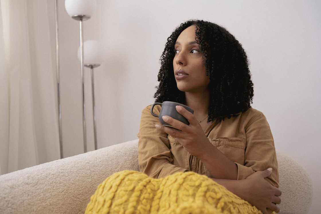 A woman holding a cup