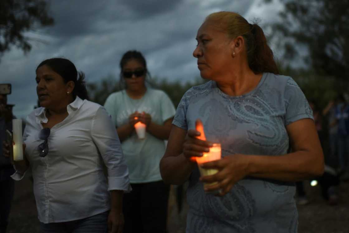 Friends and relatives hold a candlelit vigil for 10 trapped Mexican miners Friends and relatives hold a candlelit vigil for 10 trapped Mexican miners