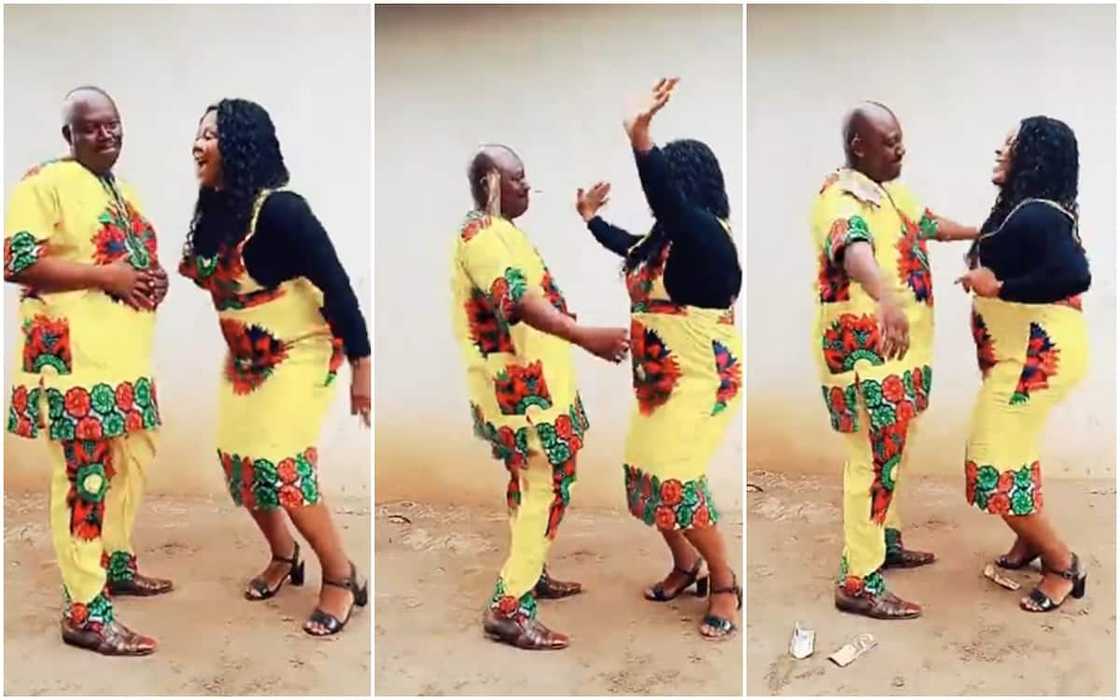 Nigerian mum seen dancing in front of her husband and showering him with cash Nigerian mum seen dancing in front of her husband and showering him with cash