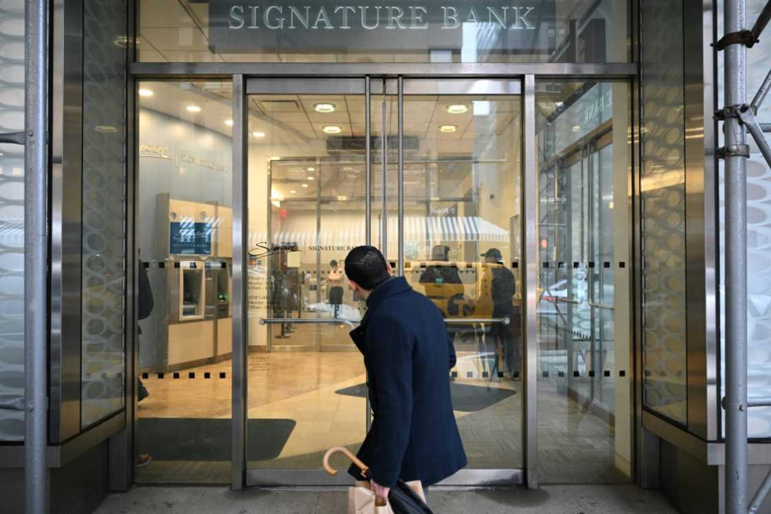 A man walks past a branch of Signature Bank in New York city on March 13, 2023 A man walks past a branch of Signature Bank in New York city on March 13, 2023