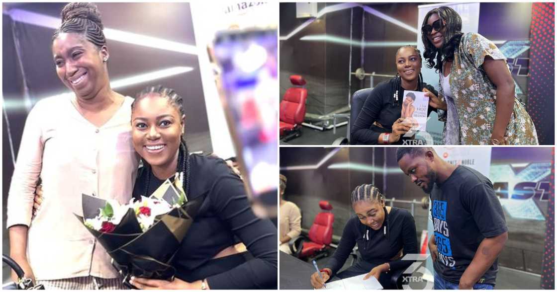 Yvonne Nelson signs book for fans