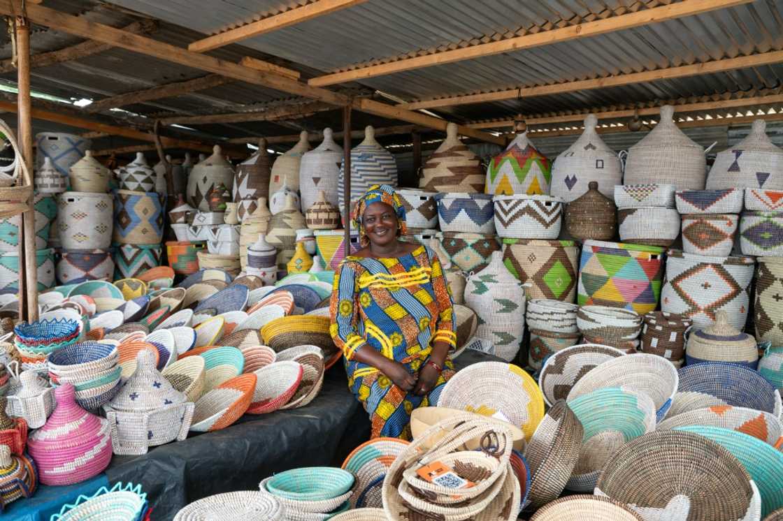Fatim Ndoye sells baskets along the highway in Ndiakhate Ndiassane, which she buys at a market Fatim Ndoye sells baskets along the highway in Ndiakhate Ndiassane, which she buys at a market