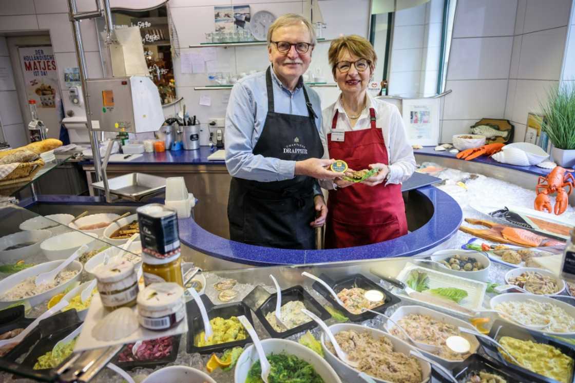 Juergen Scharringhausen and his wife Simone sell fine products from around the world in a deli that was founded by his great-great-grandfather Juergen Scharringhausen and his wife Simone sell fine products from around the world in a deli that was founded by his great-great-grandfather