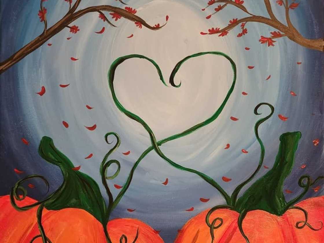 Two pumpkins entwined to form a heart shape Two pumpkins entwined to form a heart shape