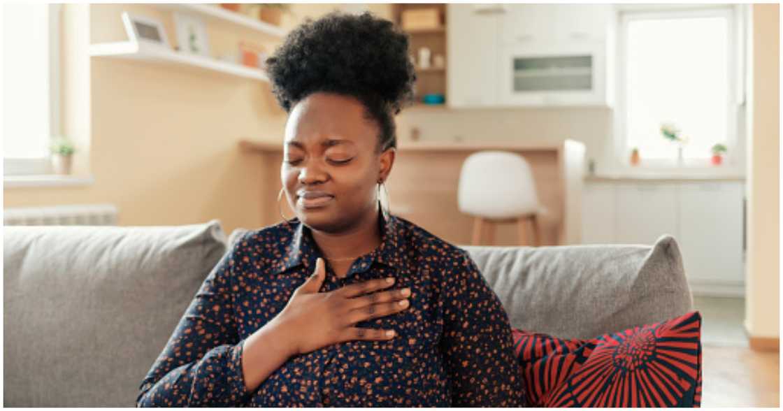 A frustrated woman tries to calm herself down