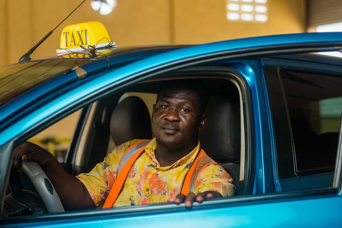 A cab driver at night