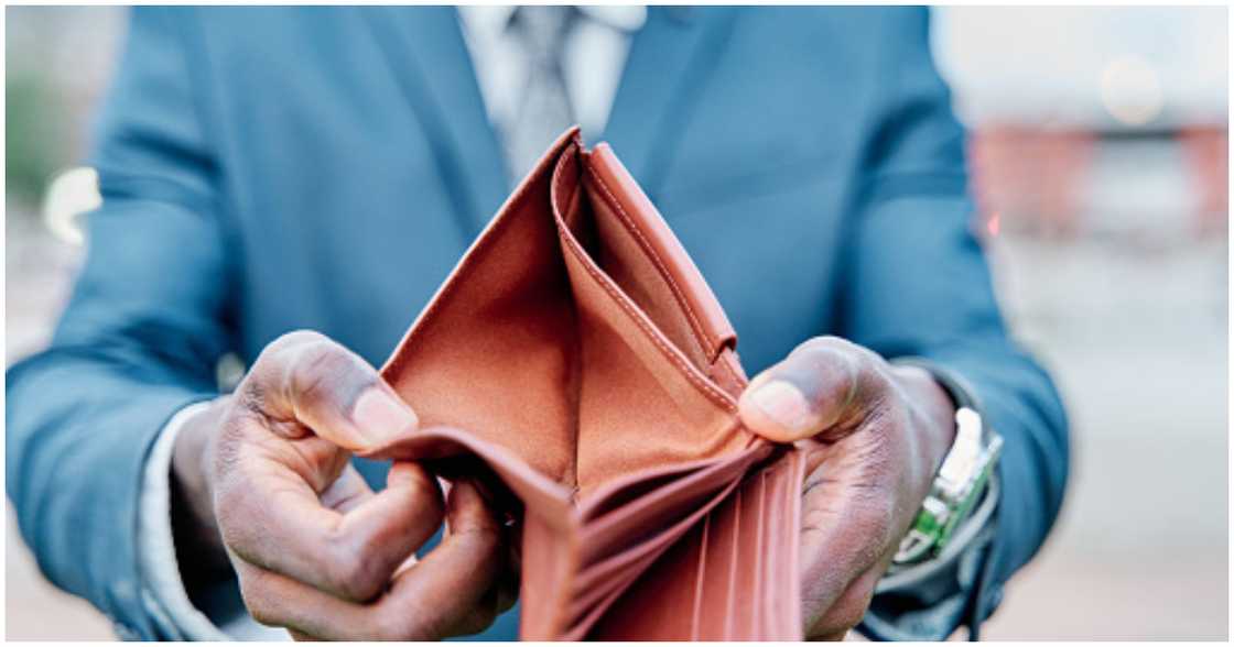 A landlord shows an empty wallet A landlord shows an empty wallet