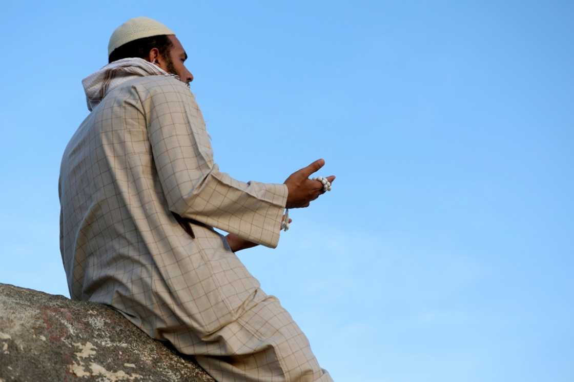 A Muslim pilgrim prays at Jabal al-Noor 'mountain of light' in Mecca. Temperatures in the holy city topped 40 degrees Celsius (104 degrees Fahrenheit) on Tuesday A Muslim pilgrim prays at Jabal al-Noor 'mountain of light' in Mecca. Temperatures in the holy city topped 40 degrees Celsius (104 degrees Fahrenheit) on Tuesday