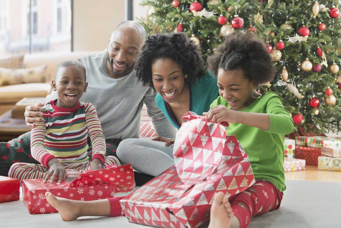 Family opening Christmas presents