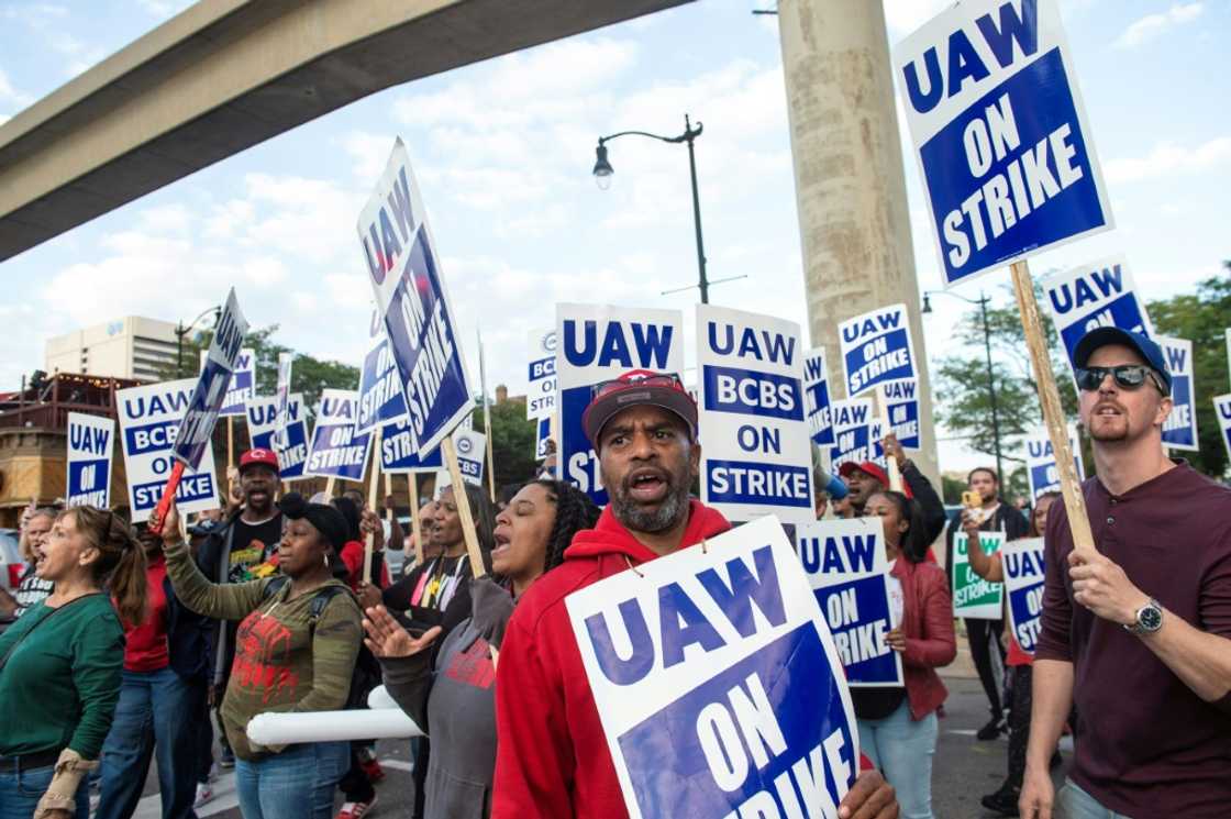 Blue Cross Blue Shield employees show their support to members of the United Auto Workers as they march through the streets of downtown Detroit following a rally on the first day of the UAW strike in Detroit, Michigan, on September 15, 2023 Blue Cross Blue Shield employees show their support to members of the United Auto Workers as they march through the streets of downtown Detroit following a rally on the first day of the UAW strike in Detroit, Michigan, on September 15, 2023