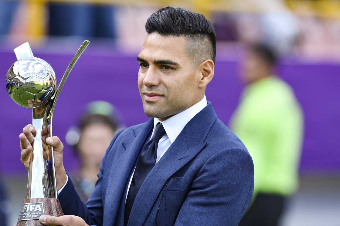 Colombian footballer Radamel Falcao holds the winner's trophy Colombian footballer Radamel Falcao holds the winner's trophy