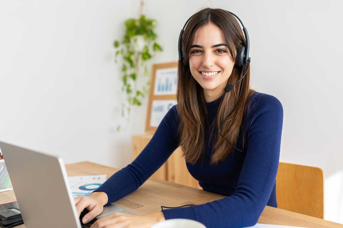 Smiling portrait of a young customer care agent