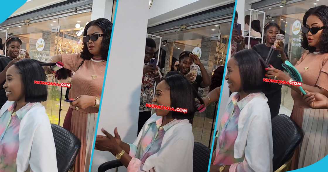 Nana Ama McBrown does a client's hair at a salon opening Nana Ama McBrown does a client's hair at a salon opening