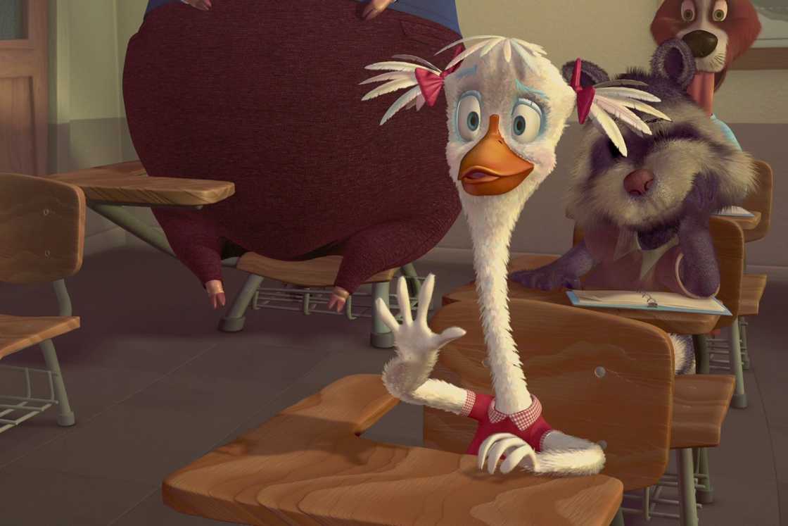 Goosey Loosey is seated in the front of a classroom Goosey Loosey is seated in the front of a classroom
