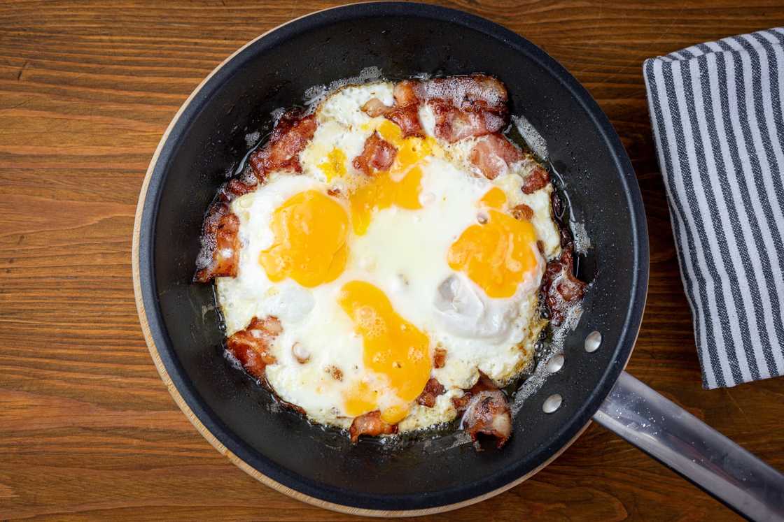 Bacon and eggs on a pan Bacon and eggs on a pan