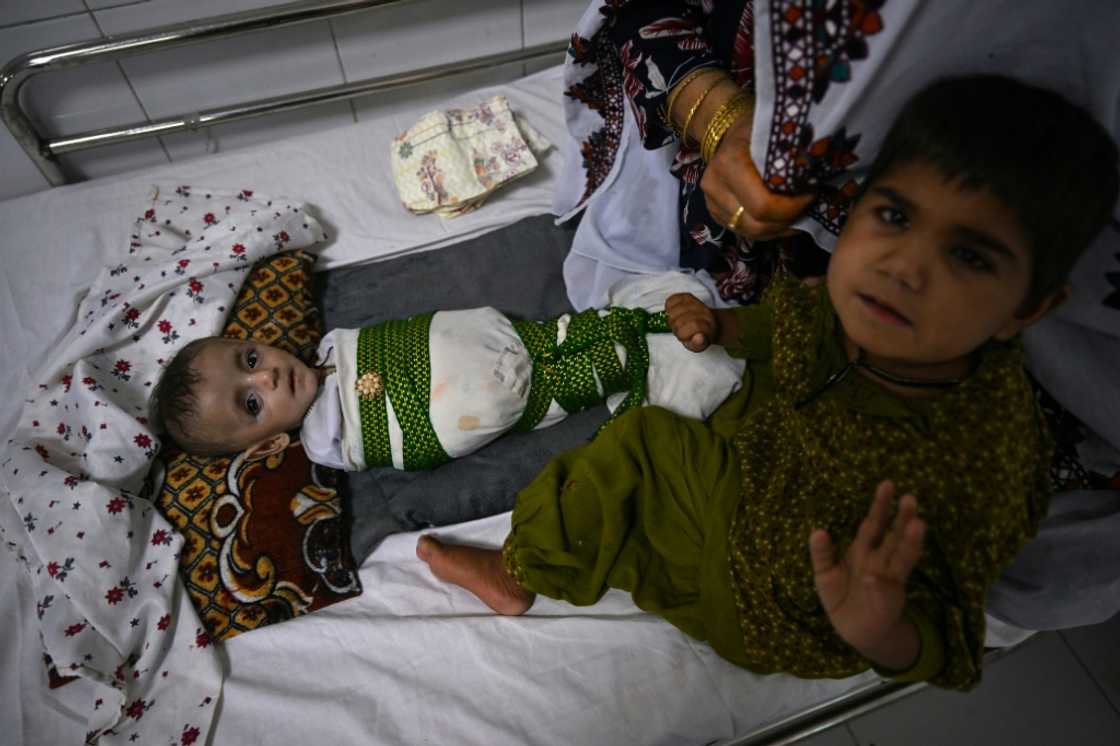 Many of the beds at Lashkar Gah's Boost Hospital host tiny, frail patients struggling to regain their strength