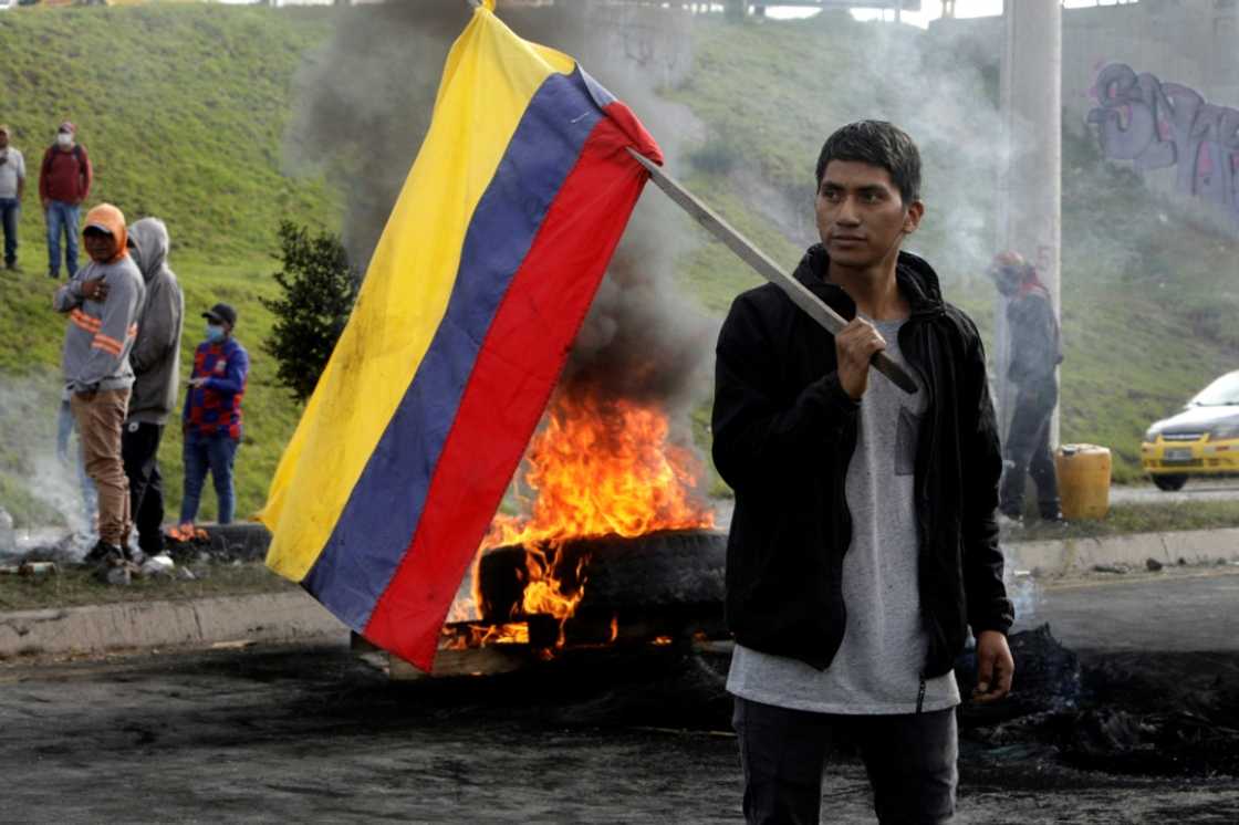 Demonstrators blocking the road to Quito international airport, as President Guillermo Lasso held talks with Indigenous groups to tackle protests over rises in fuel costs Demonstrators blocking the road to Quito international airport, as President Guillermo Lasso held talks with Indigenous groups to tackle protests over rises in fuel costs