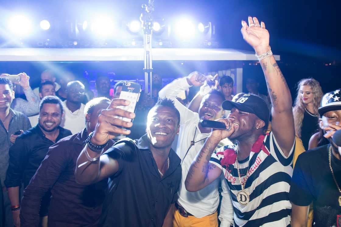 Asamoah Gyan and Davido attend the Global launch of Tulwe Music App at Dubai Marina on November 04, 2016 in Dubai, United Arab Emirates Asamoah Gyan and Davido attend the Global launch of Tulwe Music App at Dubai Marina on November 04, 2016 in Dubai, United Arab Emirates