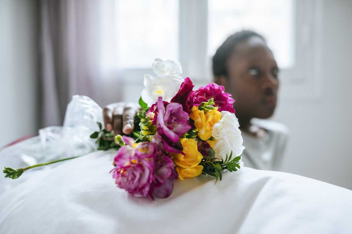 A patient receives flowers