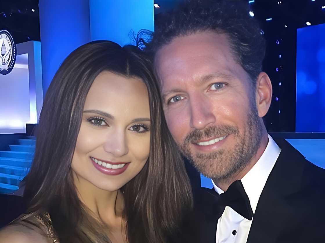 Ashley and Doug Benefield pose together in formal attire at a gala event. Ashley and Doug Benefield pose together in formal attire at a gala event.