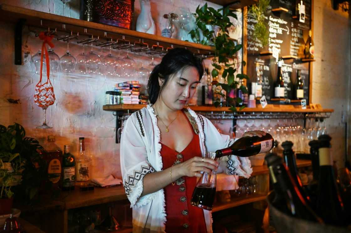 Sophie Zhou, owner of 'uh-huh Wine Bar & Eatery', says women treat wine like they do fashion as they are more likely to try different styles and tastes Sophie Zhou, owner of 'uh-huh Wine Bar & Eatery', says women treat wine like they do fashion as they are more likely to try different styles and tastes