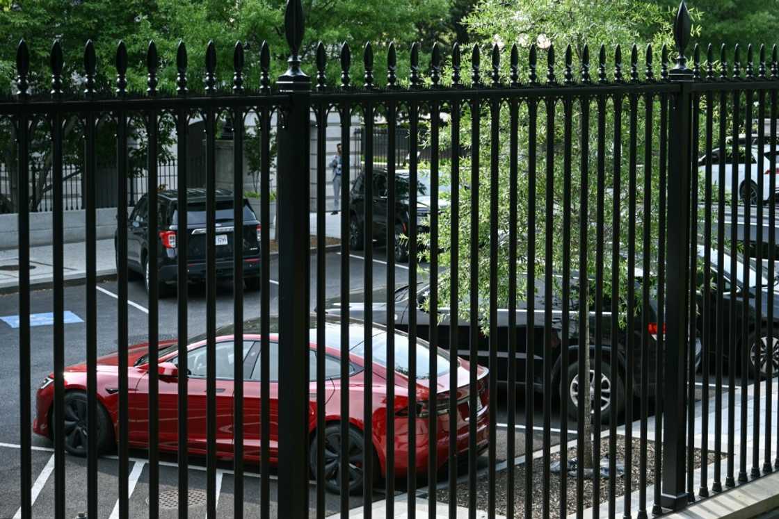 A Tesla vehicle is parked on West Executive Avenue outside the White House near the Eisenhower Executive Office Building in Washington, DC, on June 5, 2025. Donald Trump and Elon Musk's unlikely bromance imploded in spectacular fashion on June 5 as the US president and his billionaire former aide tore into each other in a very public, real-time divorce. Trump said in a televised Oval Office diatribe that he was "very disappointed" with criticisms from his top donor of a "big, beautiful" spending bill before Congress, before threatening to tear up the tycoon's multi-billion-dollar US government contracts. The South African-born Musk hit back live, saying that the Republican would not have won the 2024 election without him and slamming Trump on his X social media platform for "ingratitude."