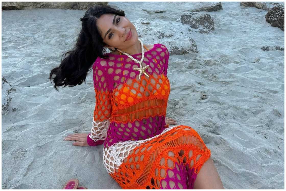 A lady in a crochet cover-up A lady in a crochet cover-up