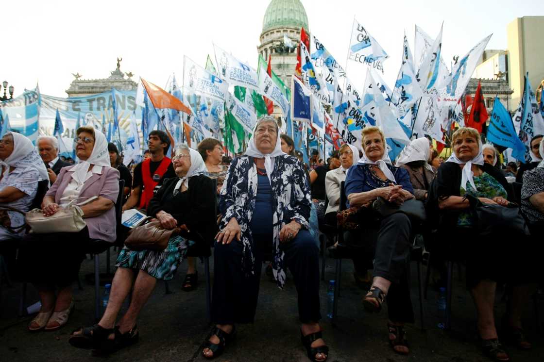 In this file photo taken on December 19, 2011, the president of the human rights organization Madres de Plaza de Mayo, Hebe de Bonafini (C), and other members of the association, are pictured during a gathering after the Argentine Congress recognized the group on its 35th anniversary, in Buenos Aires