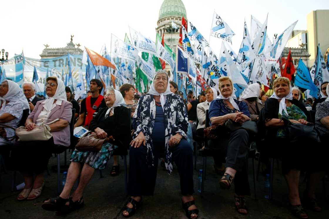 In this file photo taken on December 19, 2011, the president of the human rights organization Madres de Plaza de Mayo, Hebe de Bonafini (C), and other members of the association, are pictured during a gathering after the Argentine Congress recognized the group on its 35th anniversary, in Buenos Aires In this file photo taken on December 19, 2011, the president of the human rights organization Madres de Plaza de Mayo, Hebe de Bonafini (C), and other members of the association, are pictured during a gathering after the Argentine Congress recognized the group on its 35th anniversary, in Buenos Aires