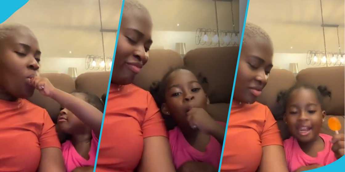 Fella Makafui and Island Frimpong eating toffee Fella Makafui and Island Frimpong eating toffee