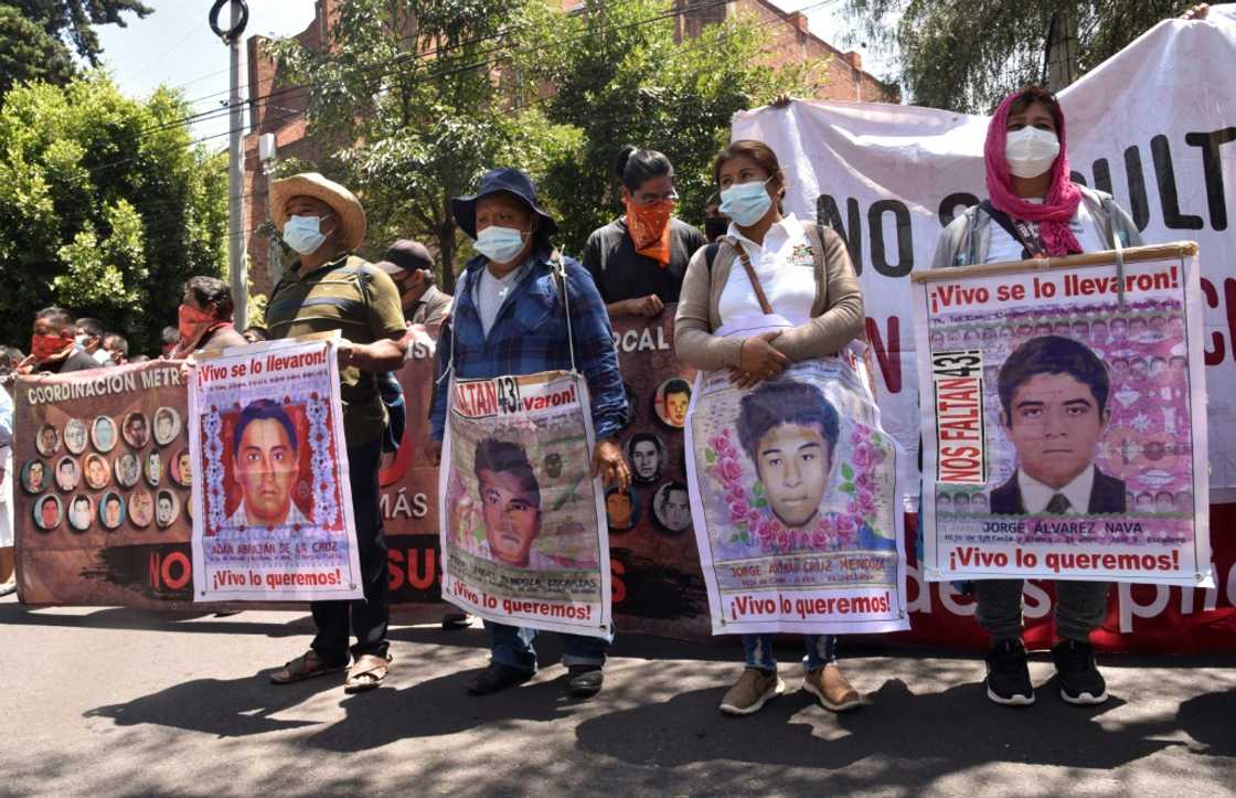 Relatives of 43 Mexican students who disappeared in 2014 protest outside the Israeli embassy in Mexico City to demand the extradition of a fugitive former investigator