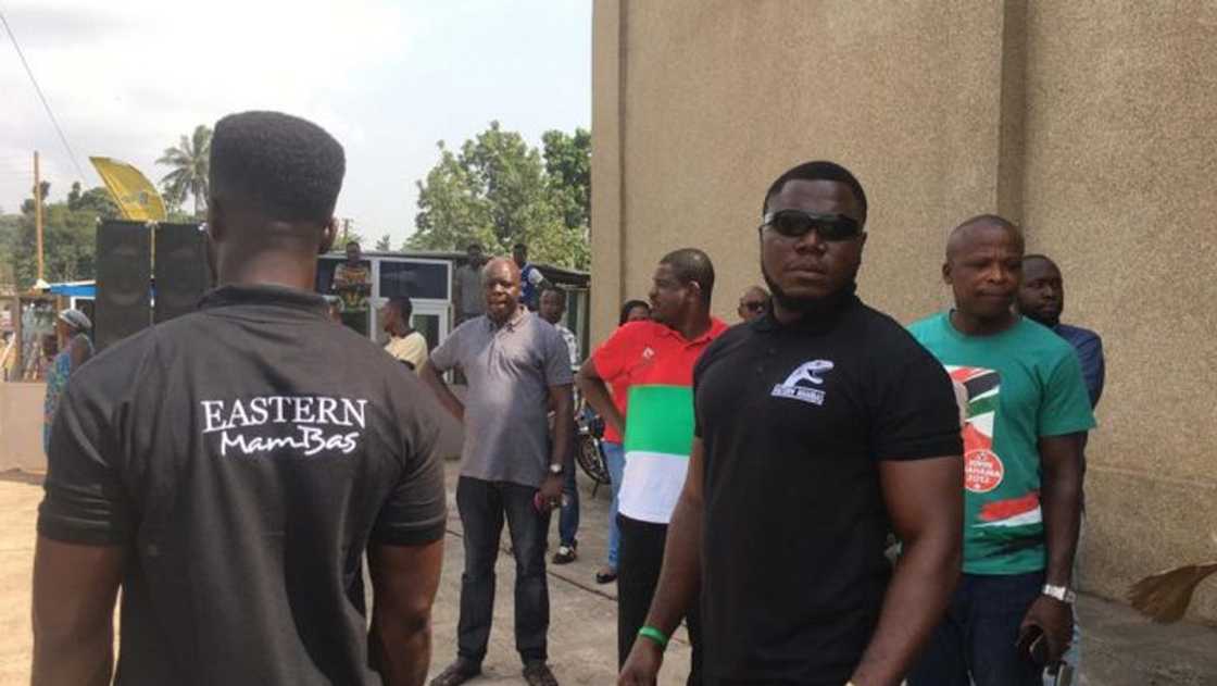 A group of people standing A group of people standing