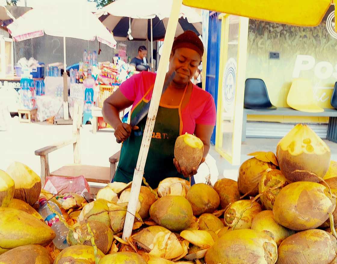 Photo of Enyonam the female coconut vendor. Photo of Enyonam the female coconut vendor.
