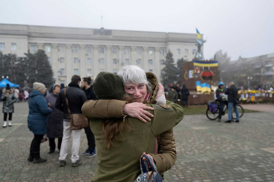 A woman hugs her friend in recently liberated Kherson A woman hugs her friend in recently liberated Kherson
