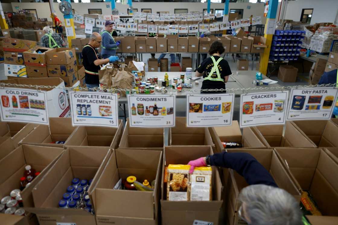 Volunteers sort through donated groceries at Daily Bread Food Bank in Toronto, Canada Volunteers sort through donated groceries at Daily Bread Food Bank in Toronto, Canada