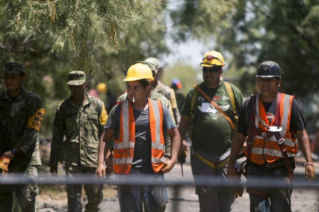 Mexican soldiers and rescue personnel work at a coal mine in northern Mexico where 10 workers have been trapped for a week