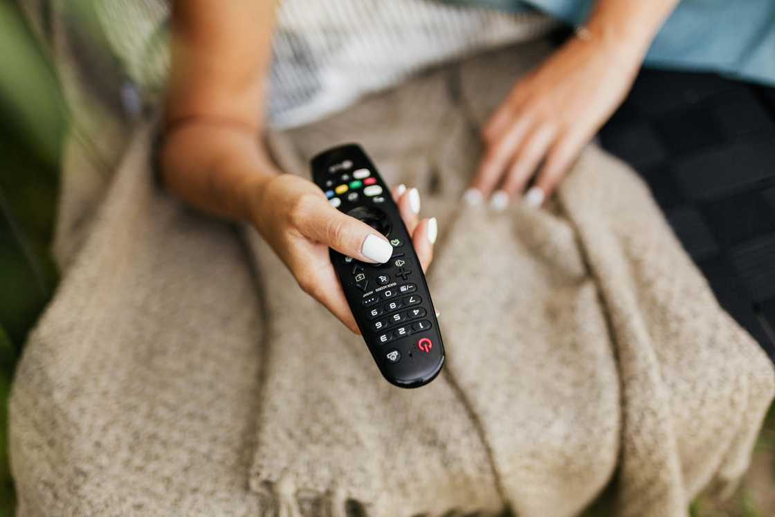A person holding the remote control A person holding the remote control