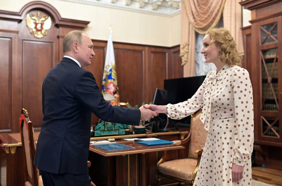 Russian Children's Rights Commissioner Maria Lvova-Belova (R, with Russian President Vladirmir Putin) was accused by the US of directing an operation to remove children from Ukraine to place with Russian families. Russian Children's Rights Commissioner Maria Lvova-Belova (R, with Russian President Vladirmir Putin) was accused by the US of directing an operation to remove children from Ukraine to place with Russian families.