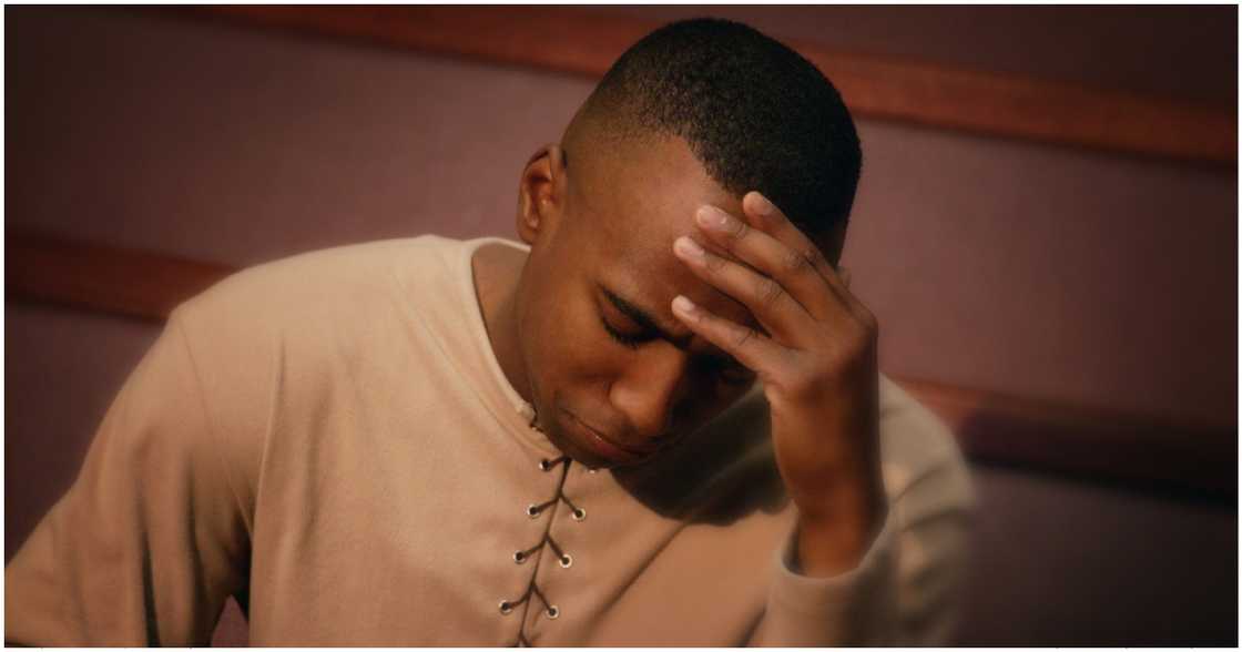 Photo of man looking confused as he falls in love with a different lady after a blood covenant Photo of man looking confused as he falls in love with a different lady after a blood covenant