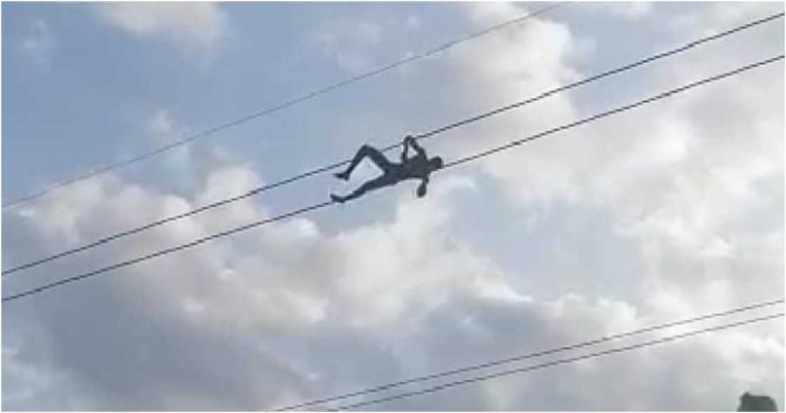 Walewale: Alleged mentally impaired man climbs and relaxes on high tension cables, video causes stir