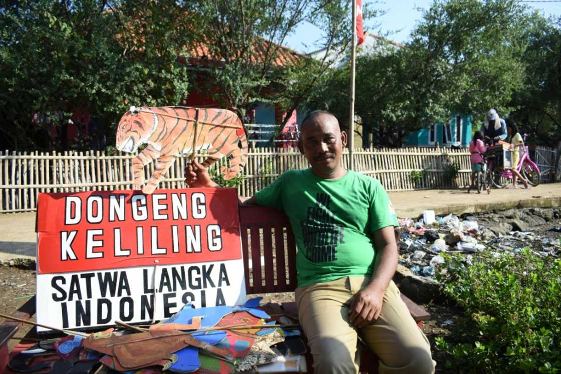 Samsudin, who like many Indonesians uses only one name, travels from village to village across the archipelago nation on an old bicycle
