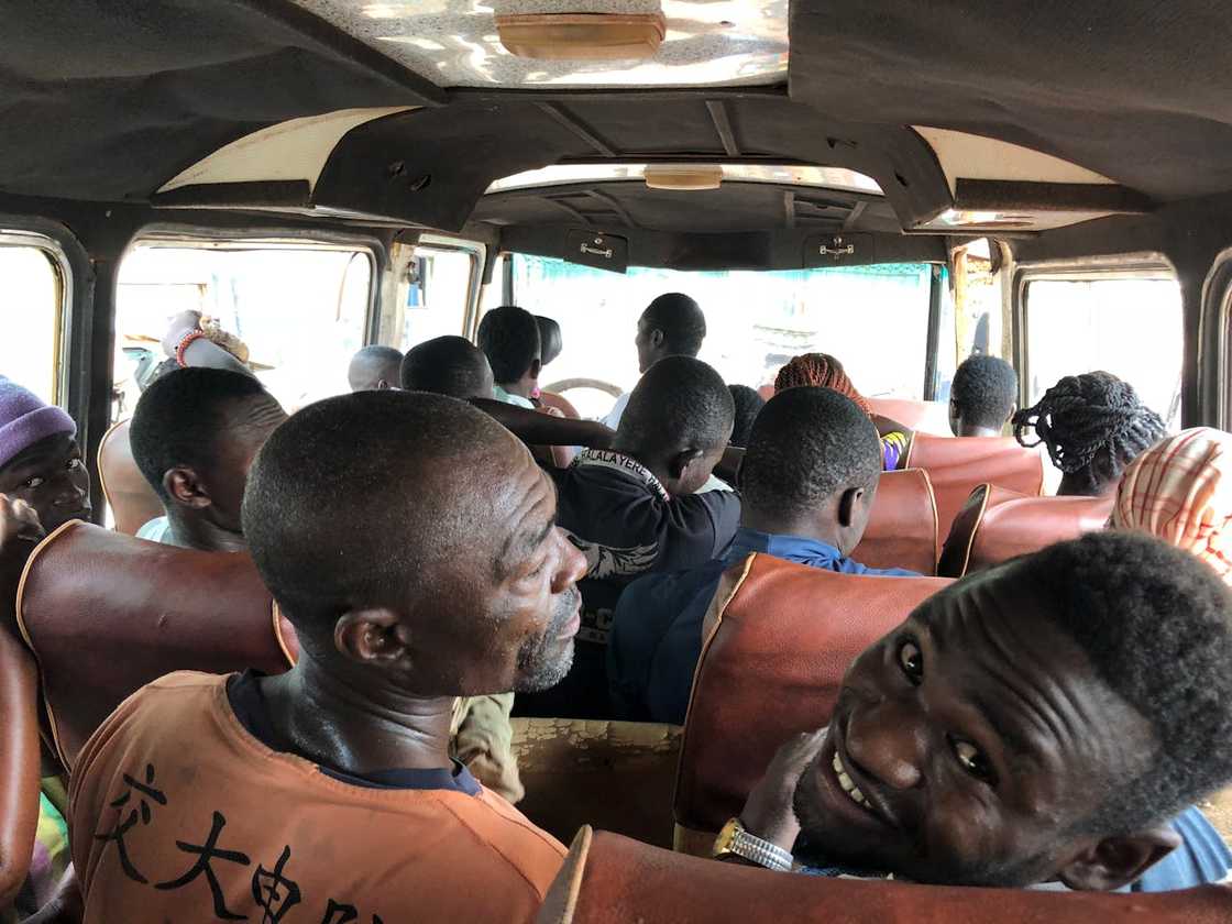 Passengers seated inside a crowded public minibus. Passengers seated inside a crowded public minibus.