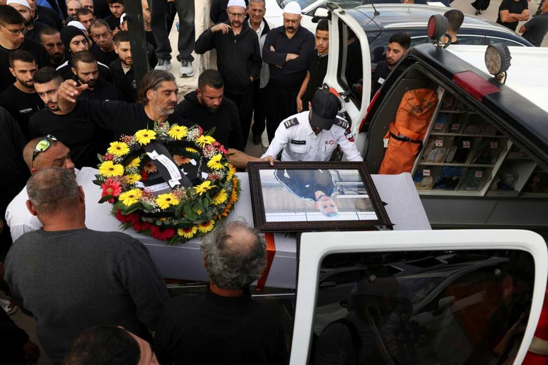 Israeli Druze men carry the coffin of 17-year-old Tiran Fero, during his funeral procession on Thursday in Daliyat al Karmel