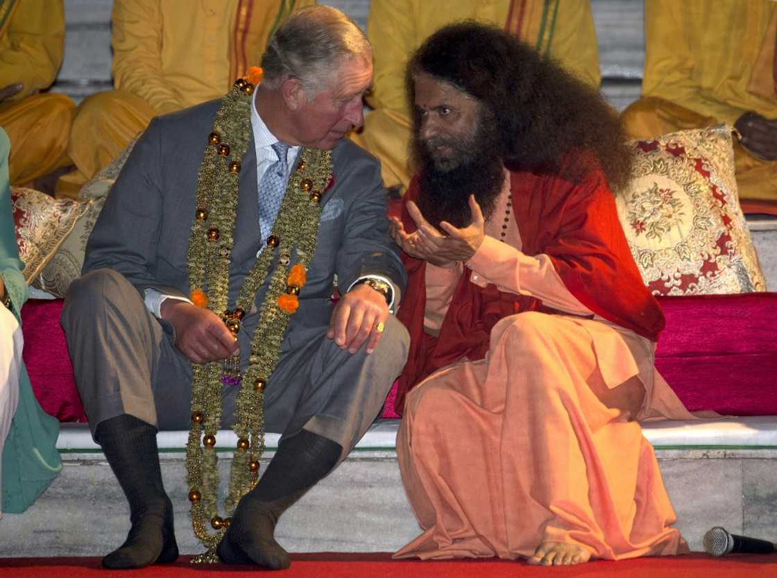 In India in 2013, Charles met Swami Chidanand Saraswatiji, president and spiritual head of the Parmarth Niketam Ashram, during the Sunset "Aarti" ceremony by the River Ganges, which is sacred to Hindus In India in 2013, Charles met Swami Chidanand Saraswatiji, president and spiritual head of the Parmarth Niketam Ashram, during the Sunset "Aarti" ceremony by the River Ganges, which is sacred to Hindus