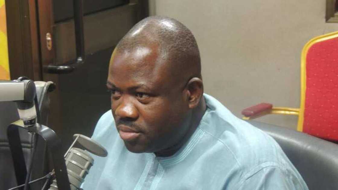 A man seated in a studio A man seated in a studio