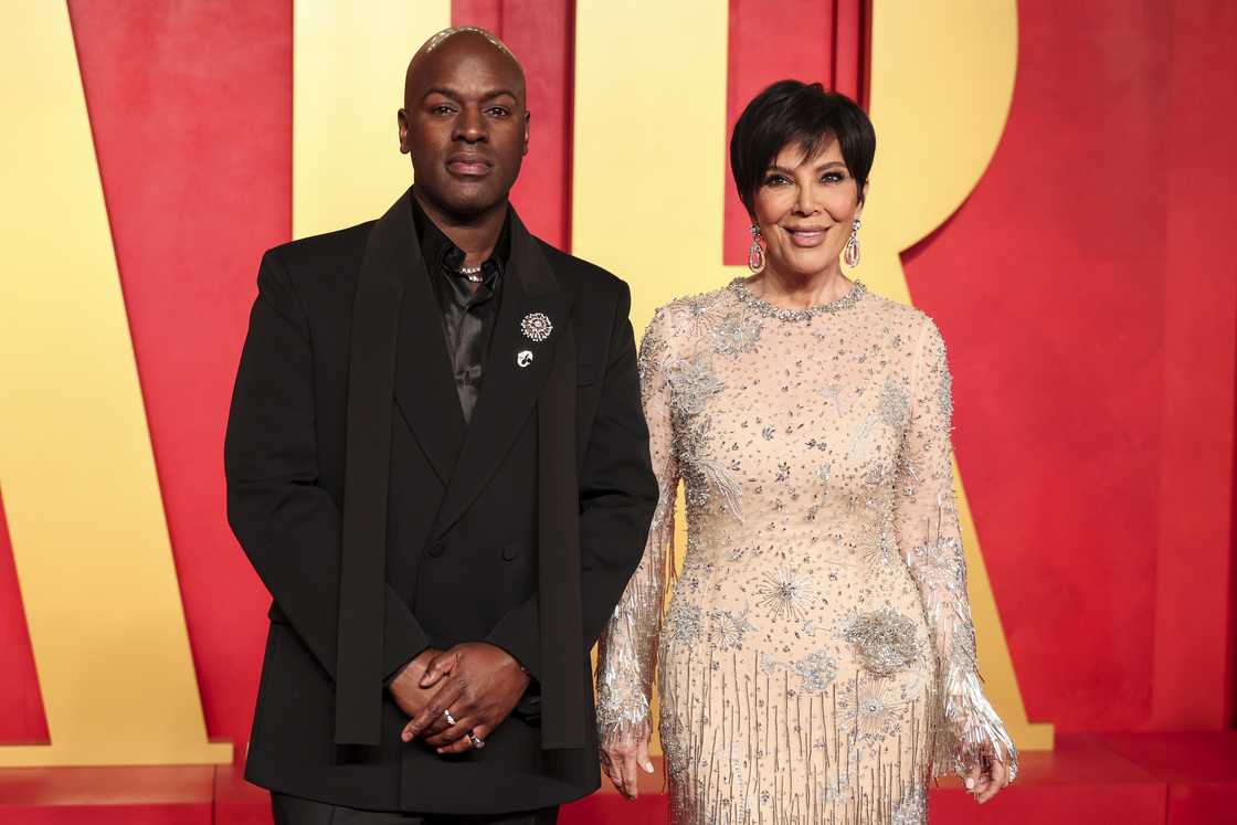 Corey Gamble and Kris Jenner pose at the 2024 Vanity Fair Oscar Party