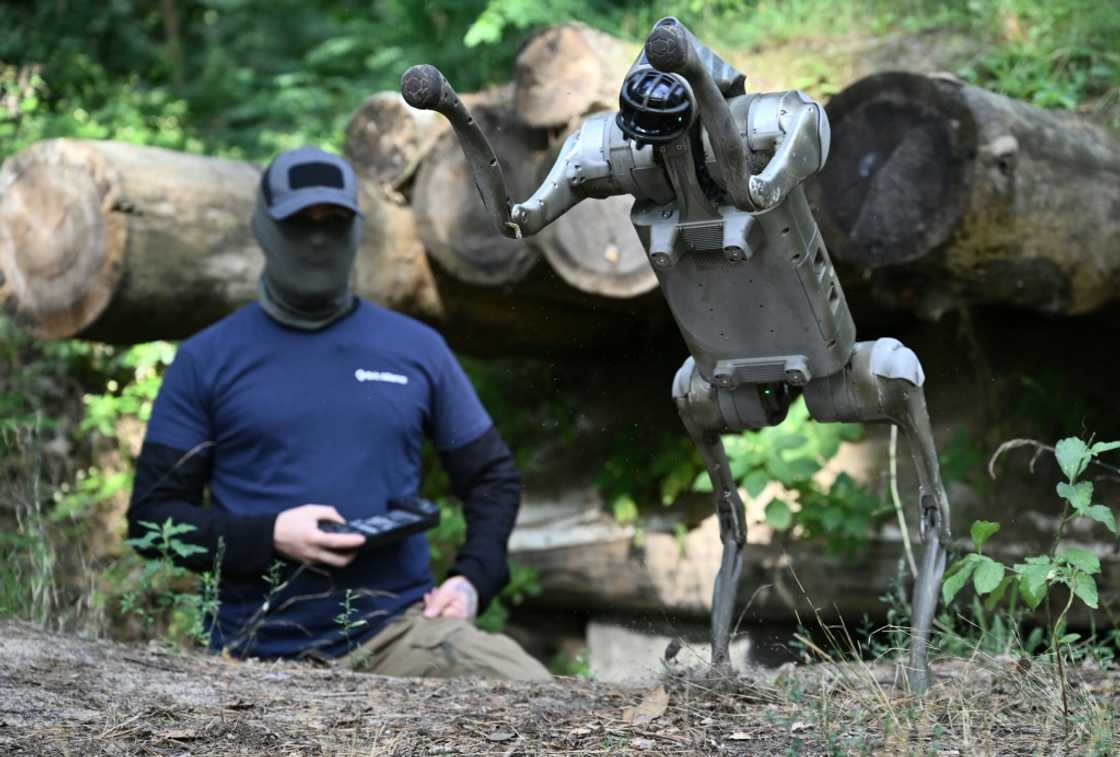 Operator 'Yuri' demonstrates the capabilities of a robot dog from his trench Operator 'Yuri' demonstrates the capabilities of a robot dog from his trench