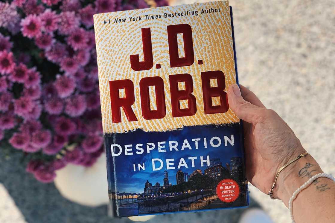 A person is holding the Desperation in Death book A person is holding the Desperation in Death book