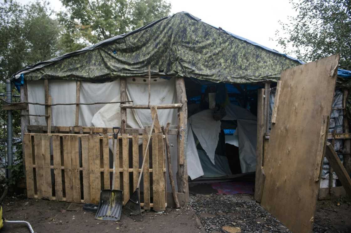 A housing structure, including a tent, is seen in a makeshift homeless encampment in a park in Granby, Canada A housing structure, including a tent, is seen in a makeshift homeless encampment in a park in Granby, Canada