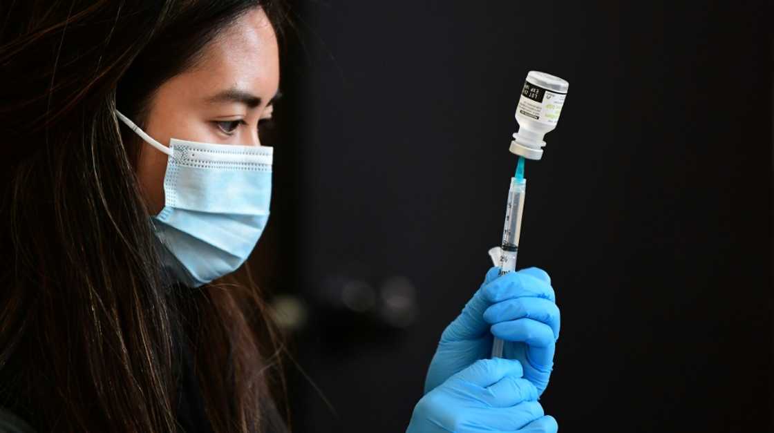 A health worker prepares to administer a vaccine in Los Angeles, California in January 2022 A health worker prepares to administer a vaccine in Los Angeles, California in January 2022